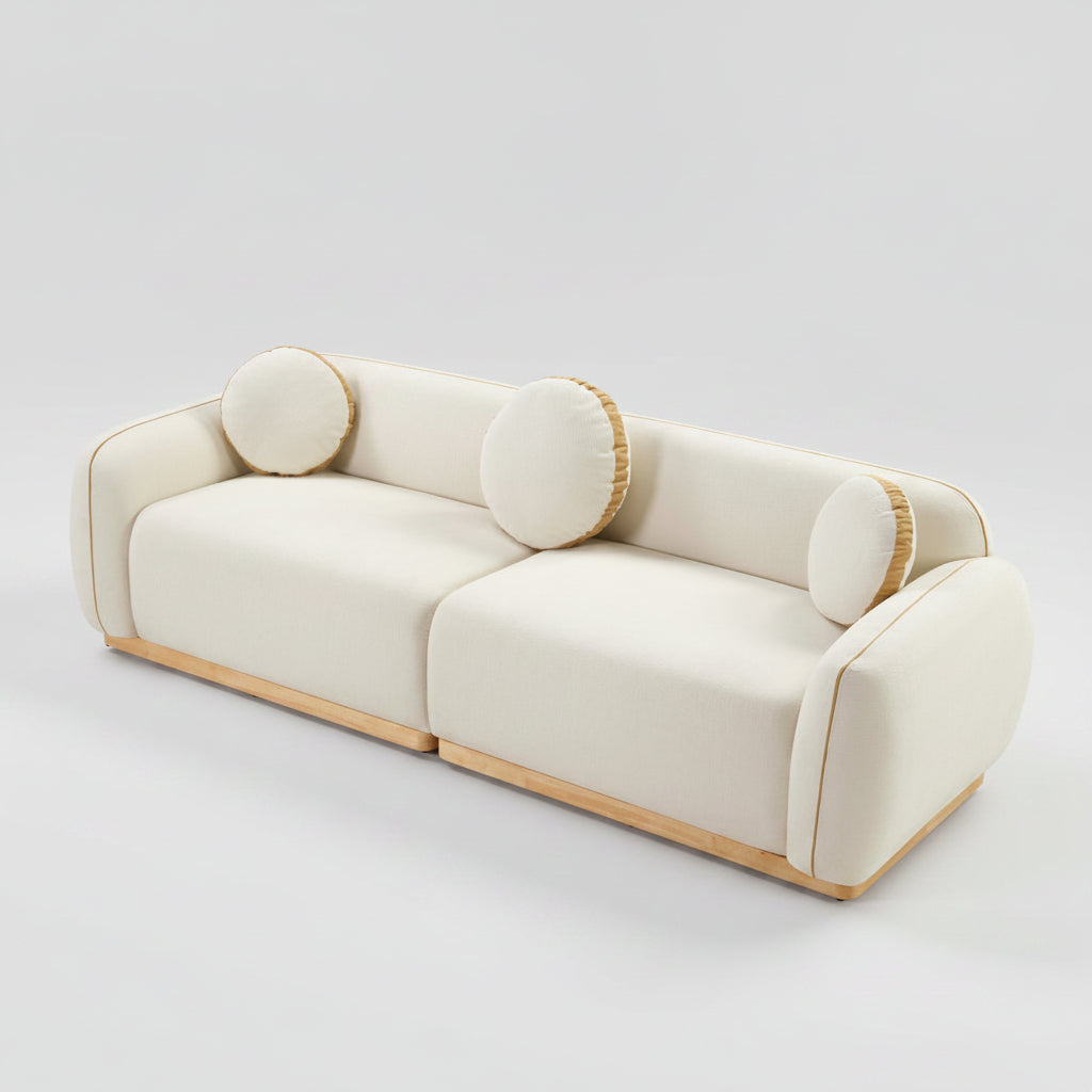 Beige sofa with circular armrests on a white background