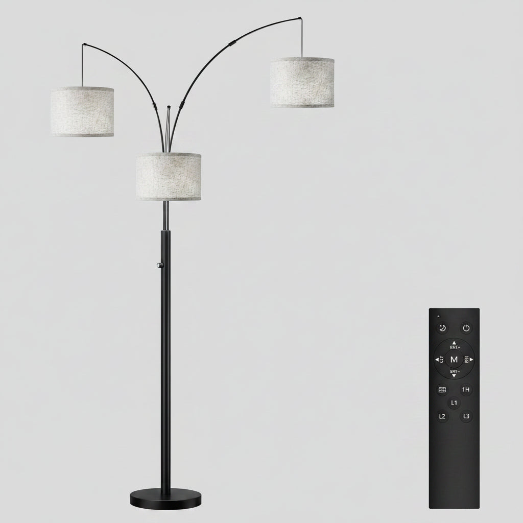 Arc floor lamp with three lampshades in a living room setting, emitting pink and yellow light.